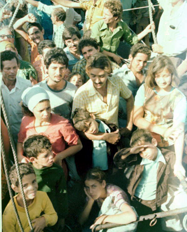 McDonald, Dale M., 1949-2007. Cuban refugees on board boat during the Mariel Boatlift - Key West, Florida. 1980. Color photoprint, 6 x 5 in. (State Archives of Florida/McDonald)